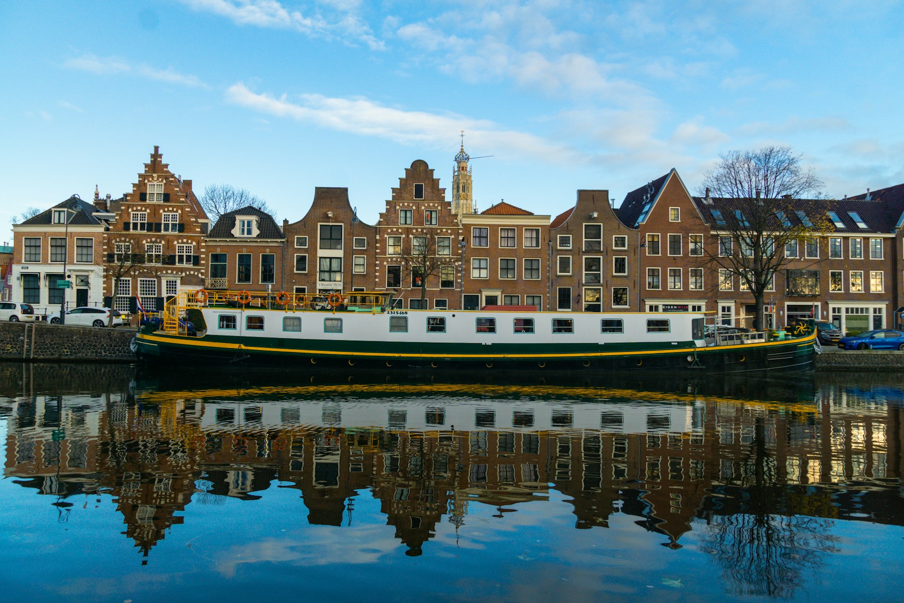 Canal houses on the Spaarne in Haarlem, with St. Bavo’s church tower